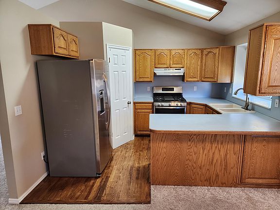 Updated Stainless Appliances. 
Side by Side fridge, Gas Range, and Dishwasher