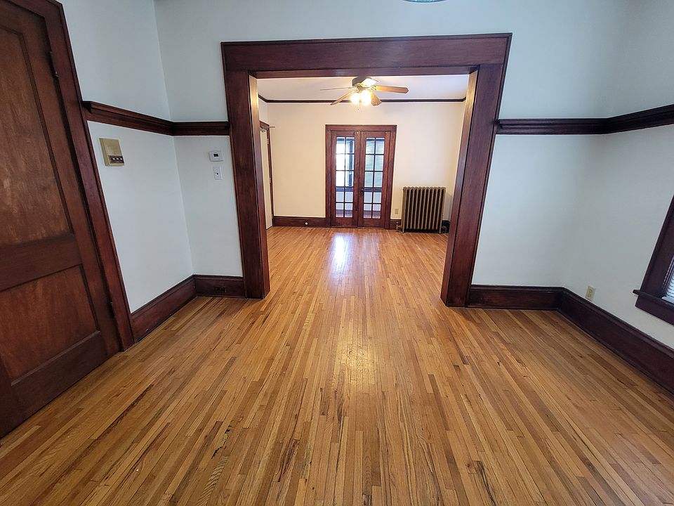 Dining room view into living room and sunroom.