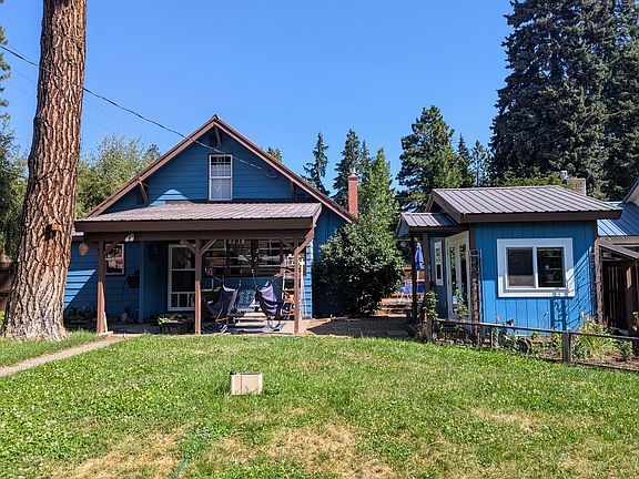 Back Yard. Mature gardens. Finished garden shed setup as home office. Mature trees with lots of shade.