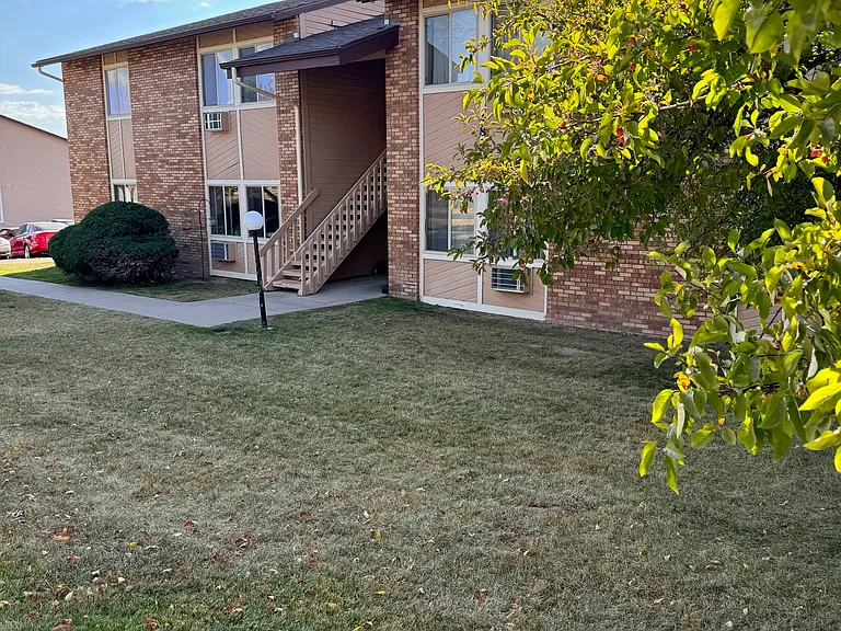 Apartment homes surrounded by green lawn common areas