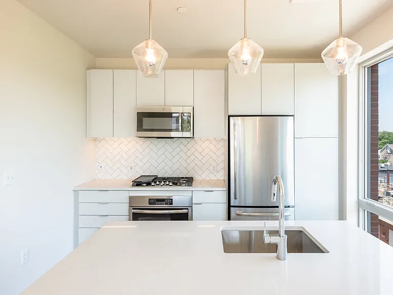 The Flats - Kitchen with Stainless Steel Appliances and Granite Countertops