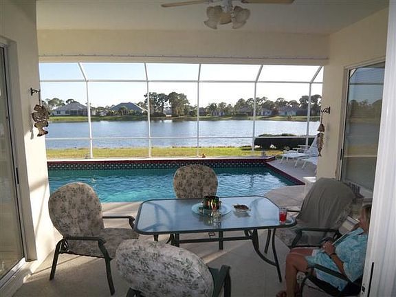Lanai overlooks lake and pool