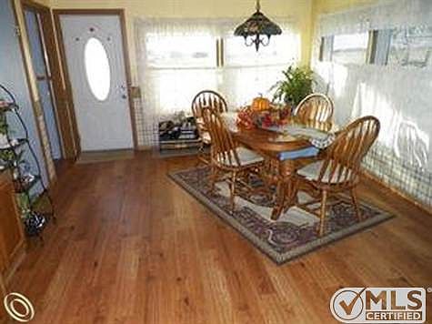 Dining room adjacent to kitchen.