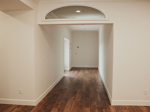 Sitting area or office nook area with French doors leading out to private balcony.