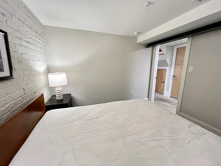 Secondary bedroom, looking out to hall.