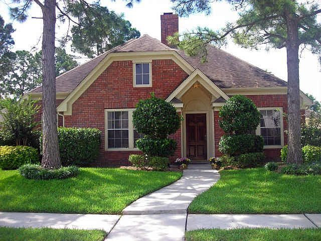Great curb appeal with established trees and landscaping