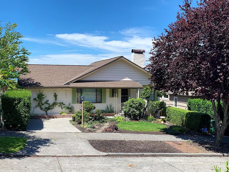6731 38th Ave SW Front of house with parking in driveway