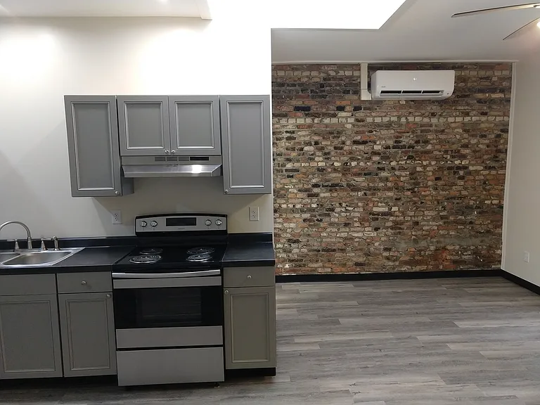 Part of the kitchen and living room. The skylight is above the kitchen - allowing lots of light.