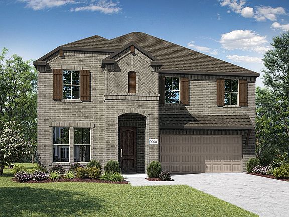 Elevation C is a two story full brick home design with arched entry, and ceder shutters and corbels.