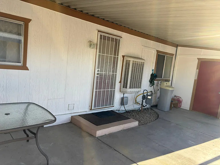 Back entrance with security door. Great area to enjoy your morning coffee.