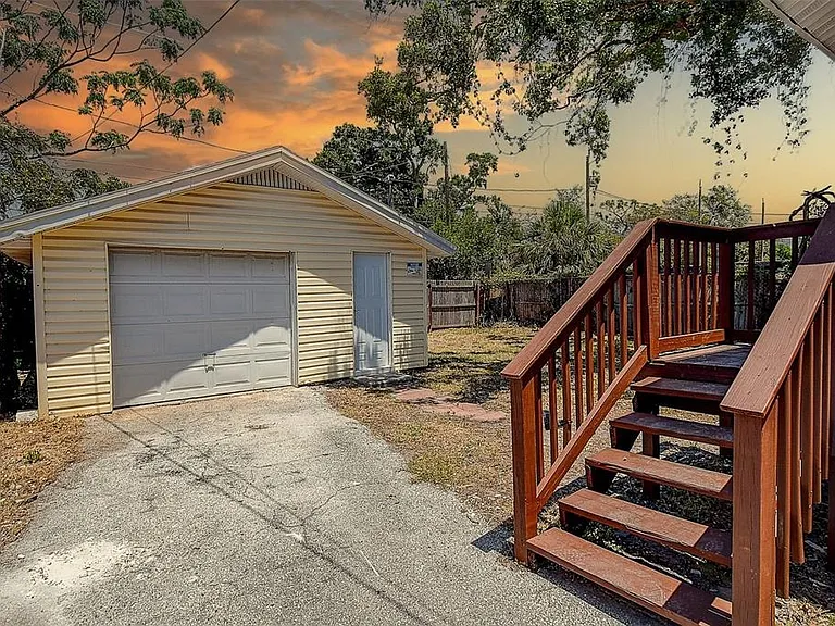 Enjoy a low-maintenance 0.13-acre lot with a 1-car detached garage, shed, and additional storage space.
