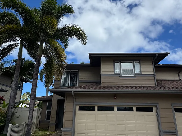 Front of the house with two car garage.