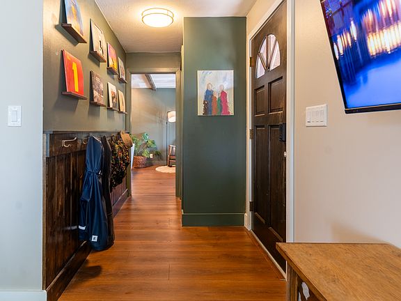 Entryway with custom feature wall to hang coats
