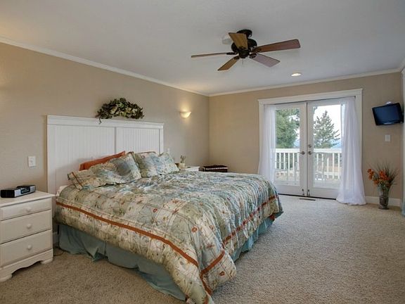 Master Suite with 3/4 bath in separate wing of the home! French doors to deck!