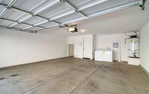 Garage. Washer/dryer recently upgraded. Shelving and storage also recently installed (not shown)