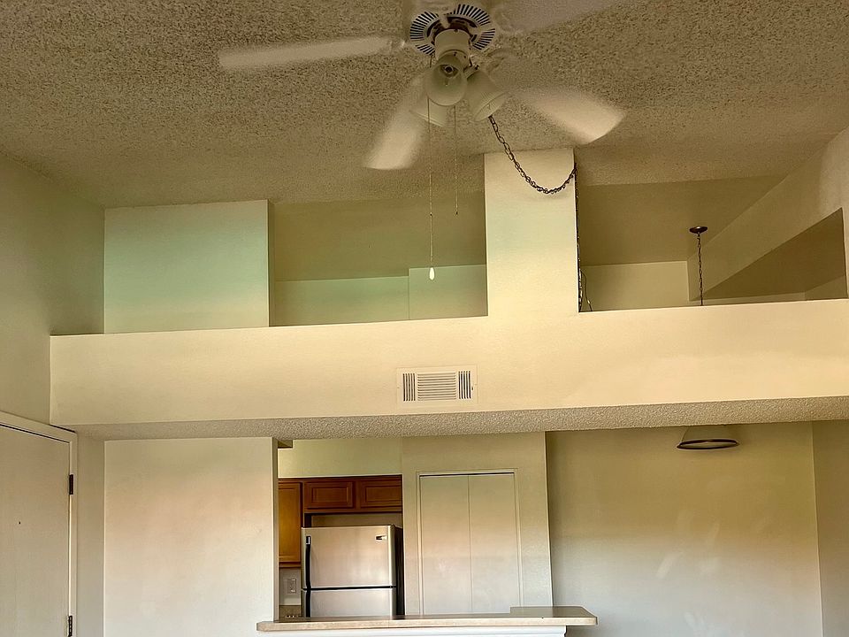 high ceilings and ceiling fans throughout home