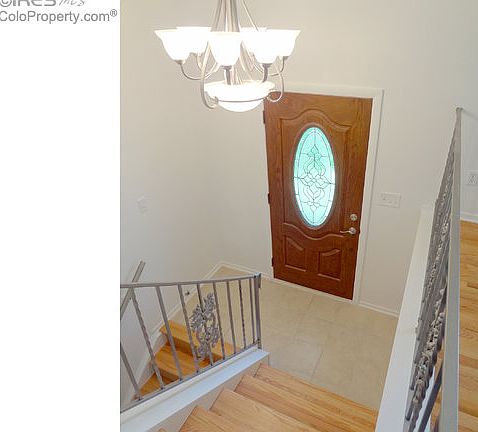 Chandelier & tile floor in entry