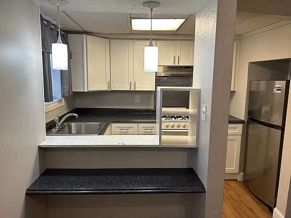 Breakfast bar and stainless refrigerator