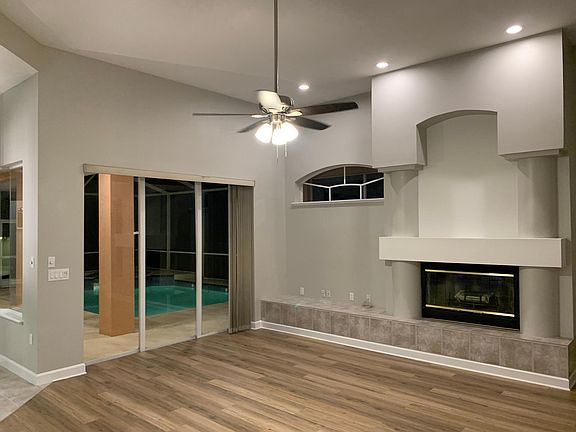 Family room and fireplace overlooking lanai