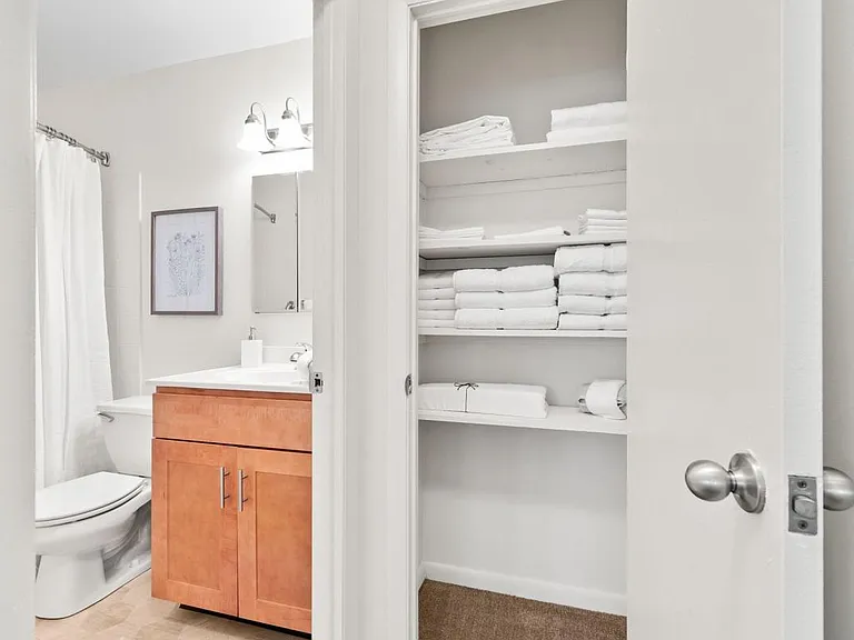 Contemporary Bathroom Style and Hallway Linen Closet- Shown in the two-bedroom floor plan