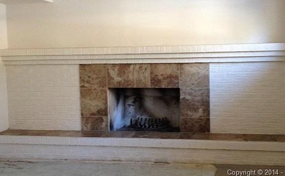 Family room with fireplace and a raised hearth