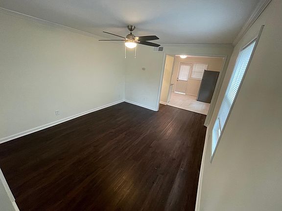 Large living room that leads into kitchen.