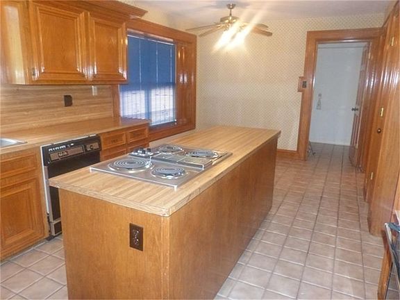 The cooktop is conveniently located in the island.