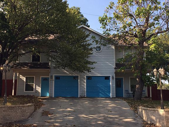 Front picture of both parts of the Duplex. The left half is 2529 Dalford and the right half is 2531 Dalford.