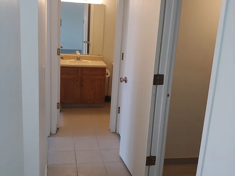 View From Condo Entrance Down Hallway to Bathroom