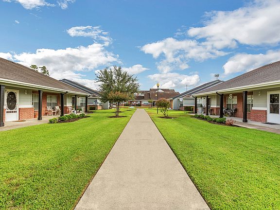 Scenic Walking Path Between Apartments at Humble Memorial Gardens in Humble, TX