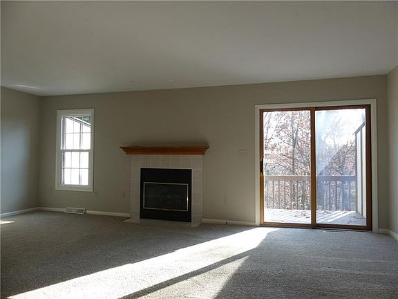 The focal point of the bright, spacious living room is the gas fireplace.