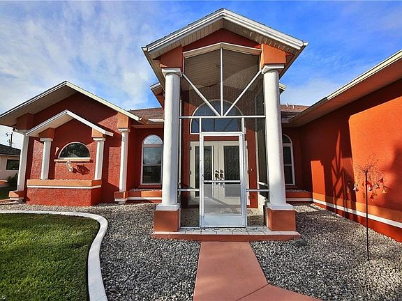 The screened entry leads you to beautiful leaded glass double doors