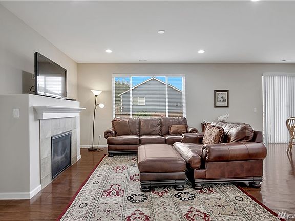 Open concept living area with gas fireplace. 