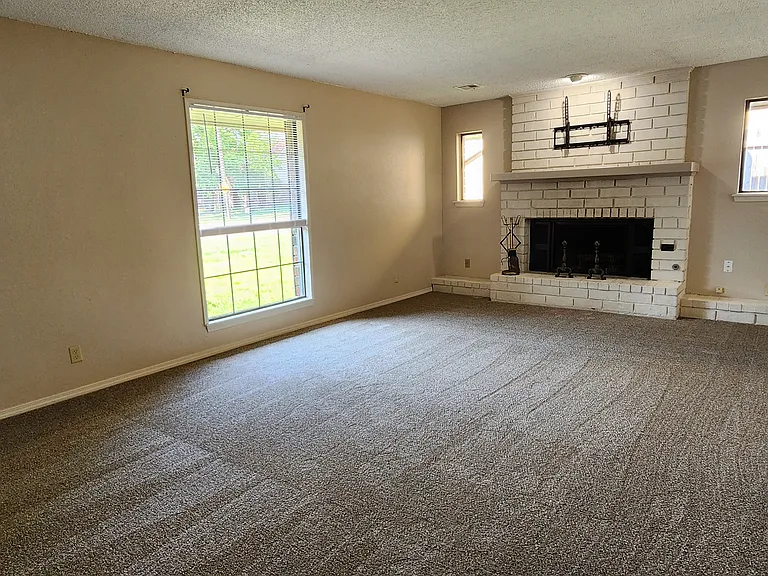 LIVING ROOM- WINDOW TO FRONT YARD - TV OVER FIREPLACE