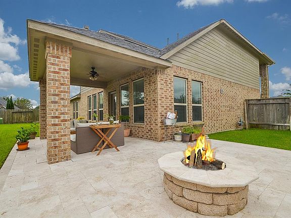 What a great outdoor living space! Your friends and family will love gathering on this astonishing backyard.