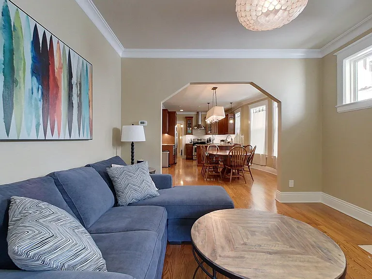 The spacious living room is filled with natural light.