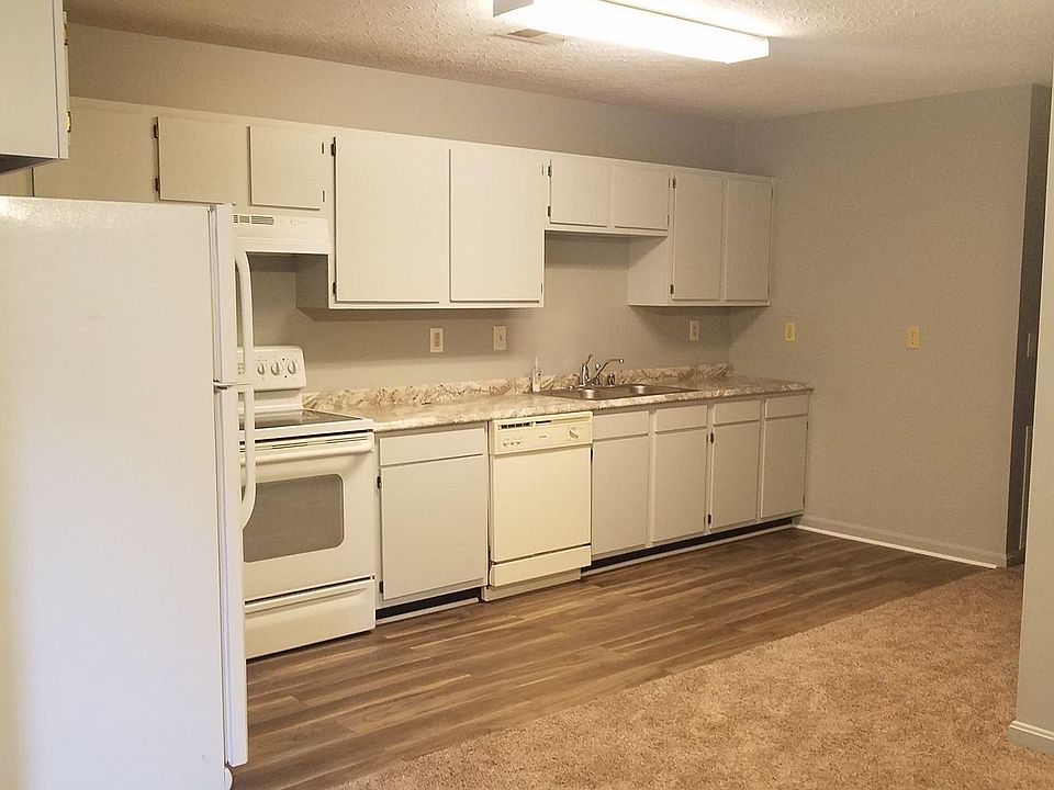 Looking from the living room into the kitchen with new flooring, counter tops and paint. All appliances are included.