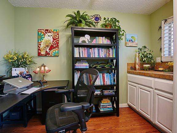 Den with office and wet bar.
