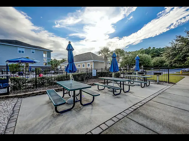 Feel like cooking out? Take advantage of the picnic tables and charcoal grills by the Willow Bend pool.