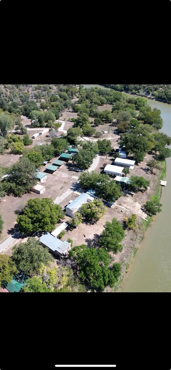 Aerial photos show the green RV Covers of Brazos RV Resort. - 136 Chavez Trl