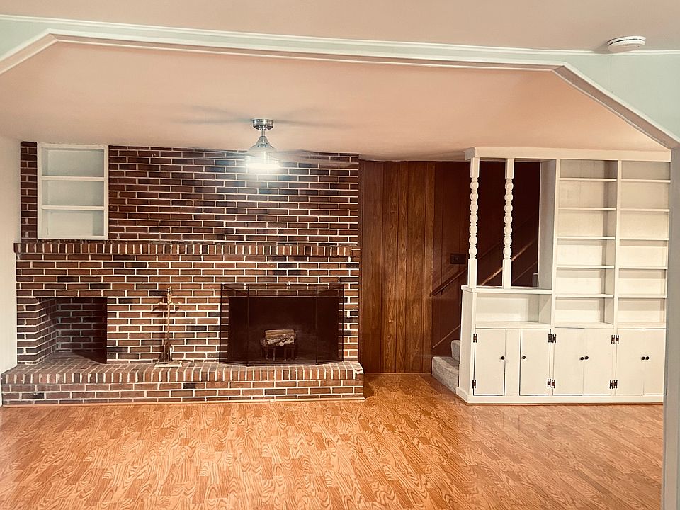 Living room w/ wood-burning fireplace