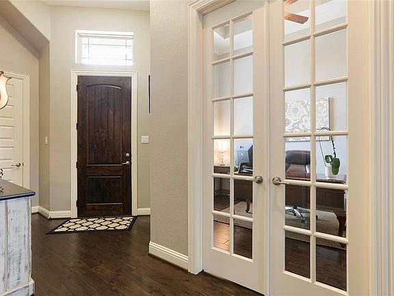 As you enter the home you are greeted with beautiful hardwood floors that continue thru all of the downstairs living spaces. The French Doors add the extra privacy for the owner who wants to work from home.