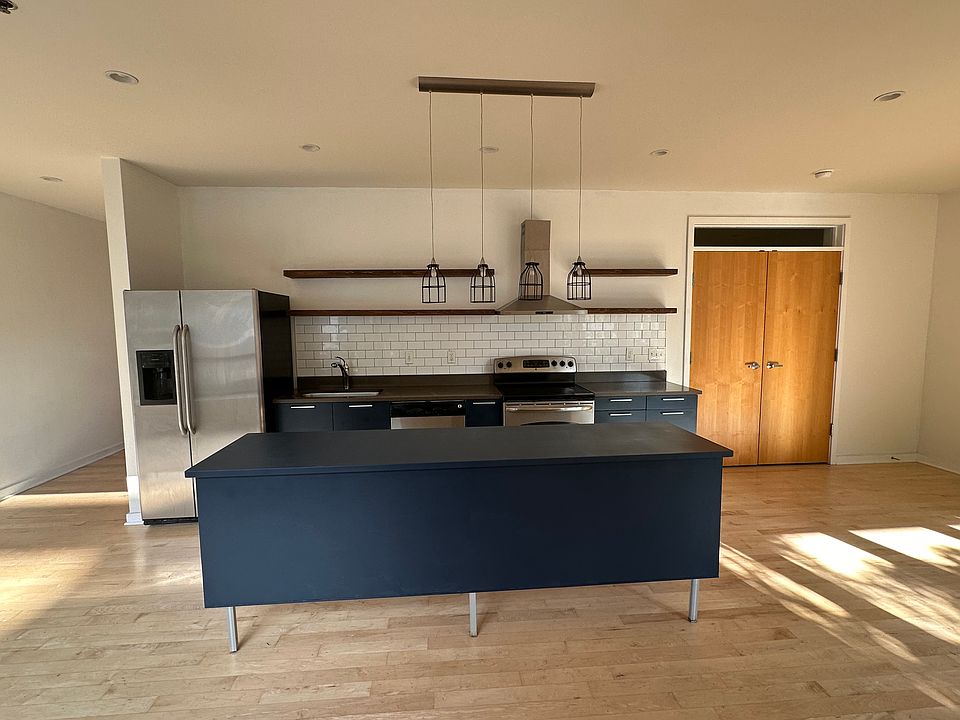 Open floor plan, light-filled with new kitchen