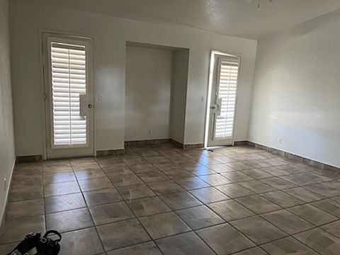 Living room with doors leading to backyard