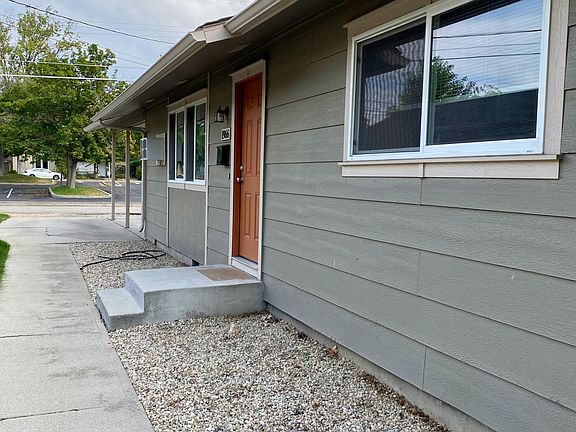 Entrance towards the covered parking. Behind the house is a church parking lot, which helps it feel more open and reduces neighbor noise.
