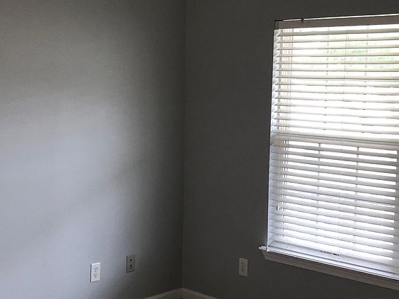 The Master bedroom is large and boast plantation blinds and a private bathroom.