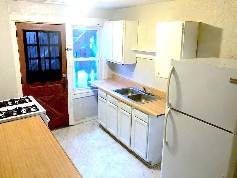 Cute kitchen with Butcher Block Counters