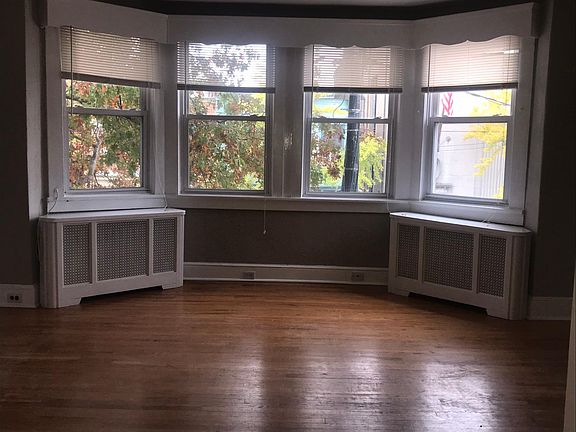 Living room's four windows looking out to Haddon Avenue