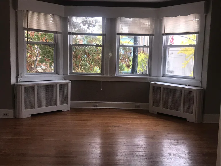 Living room's four windows looking out to Haddon Avenue