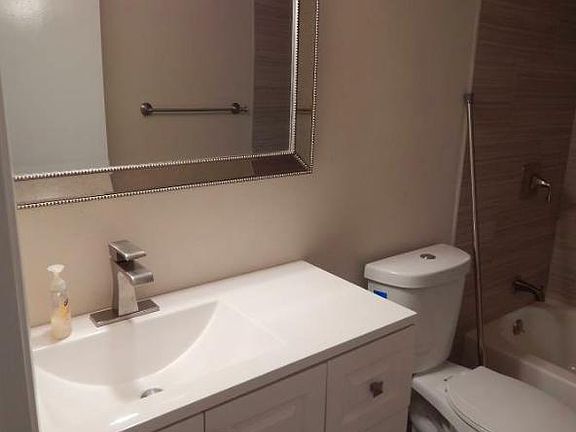 Marble tile and vanity.